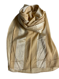 Beige scarf with subtle pattern on a white background