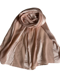 Brown scarf draped over a white background
