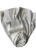 White fabric with subtle pattern on a white background