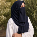 Woman wearing classic black georgette hijab with matching niqab outdoors