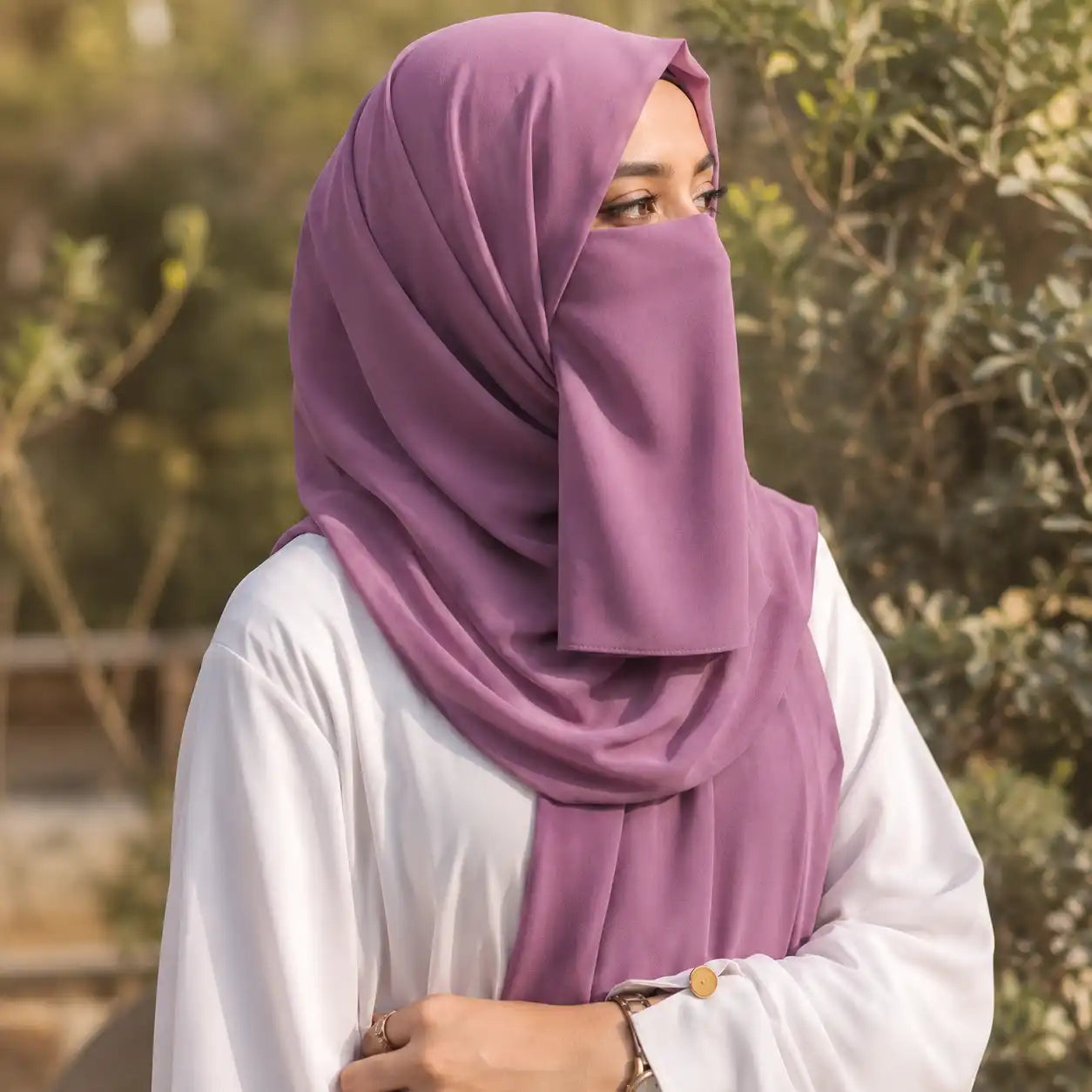 Woman wearing royal purple georgette hijab with matching niqab