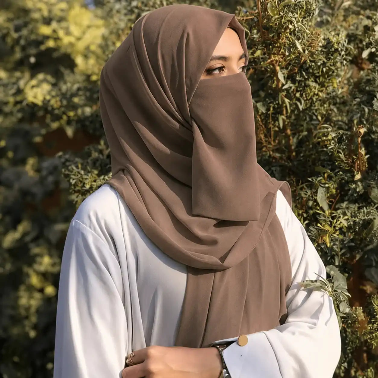 Woman wearing mocha brown georgette hijab with matching niqab