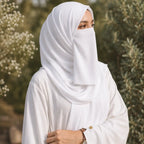 Woman wearing pure white georgette hijab with matching niqab