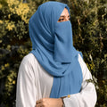 Woman wearing steel blue georgette hijab with matching niqab