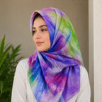 Woman wearing purple blue green watercolor slub lawn hijab styled look
