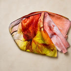 Slub lawn hijab orange mustard floral flat lay showing fabric texture