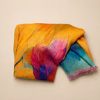 Slub lawn hijab orange teal watercolor mix flat lay showing fabric texture